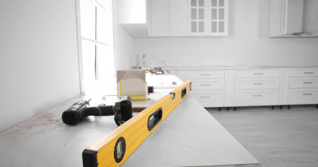 Maintenance tools on countertop in modern renovated kitchen